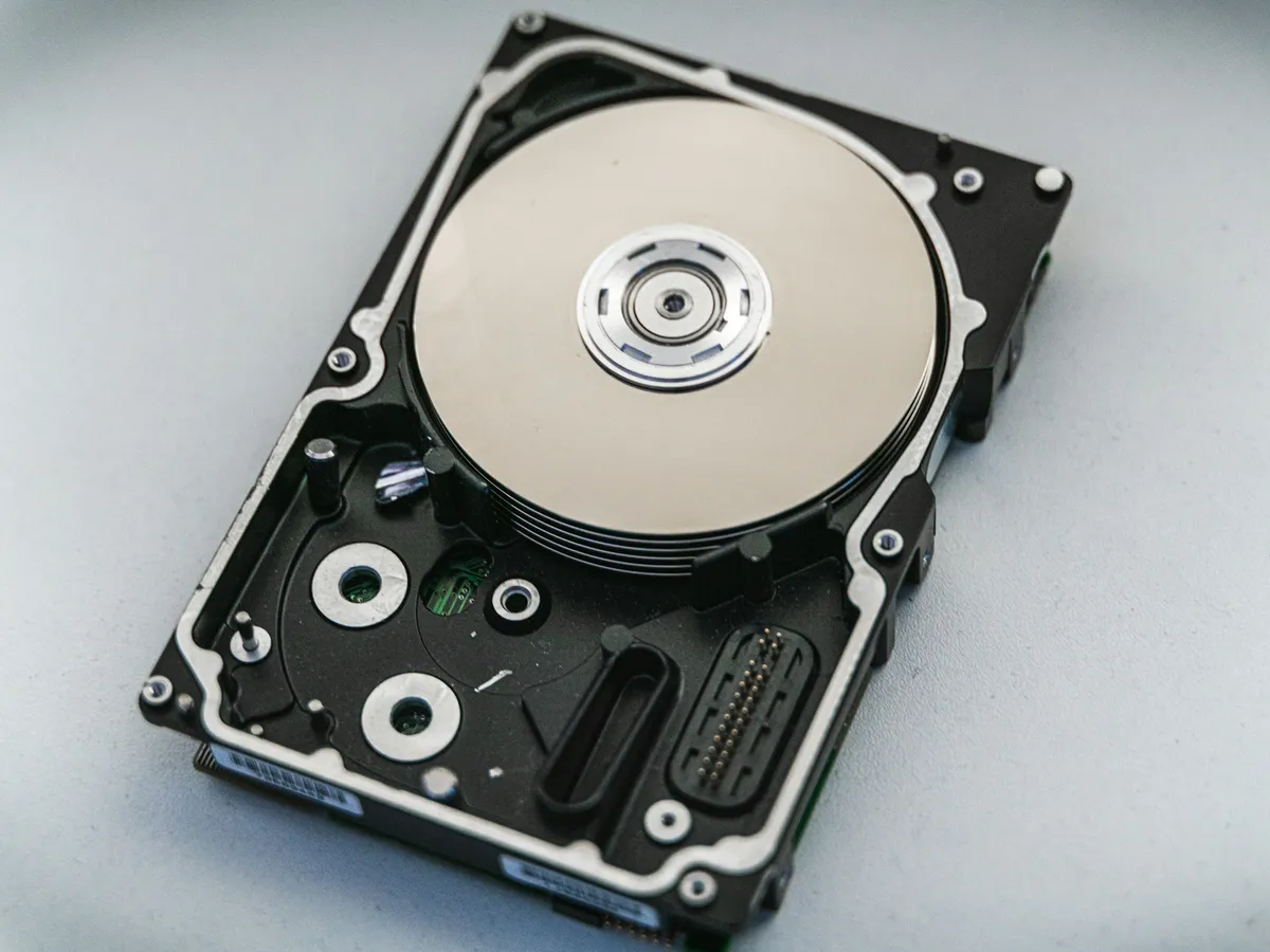 An open hard disk drive with its platter exposed