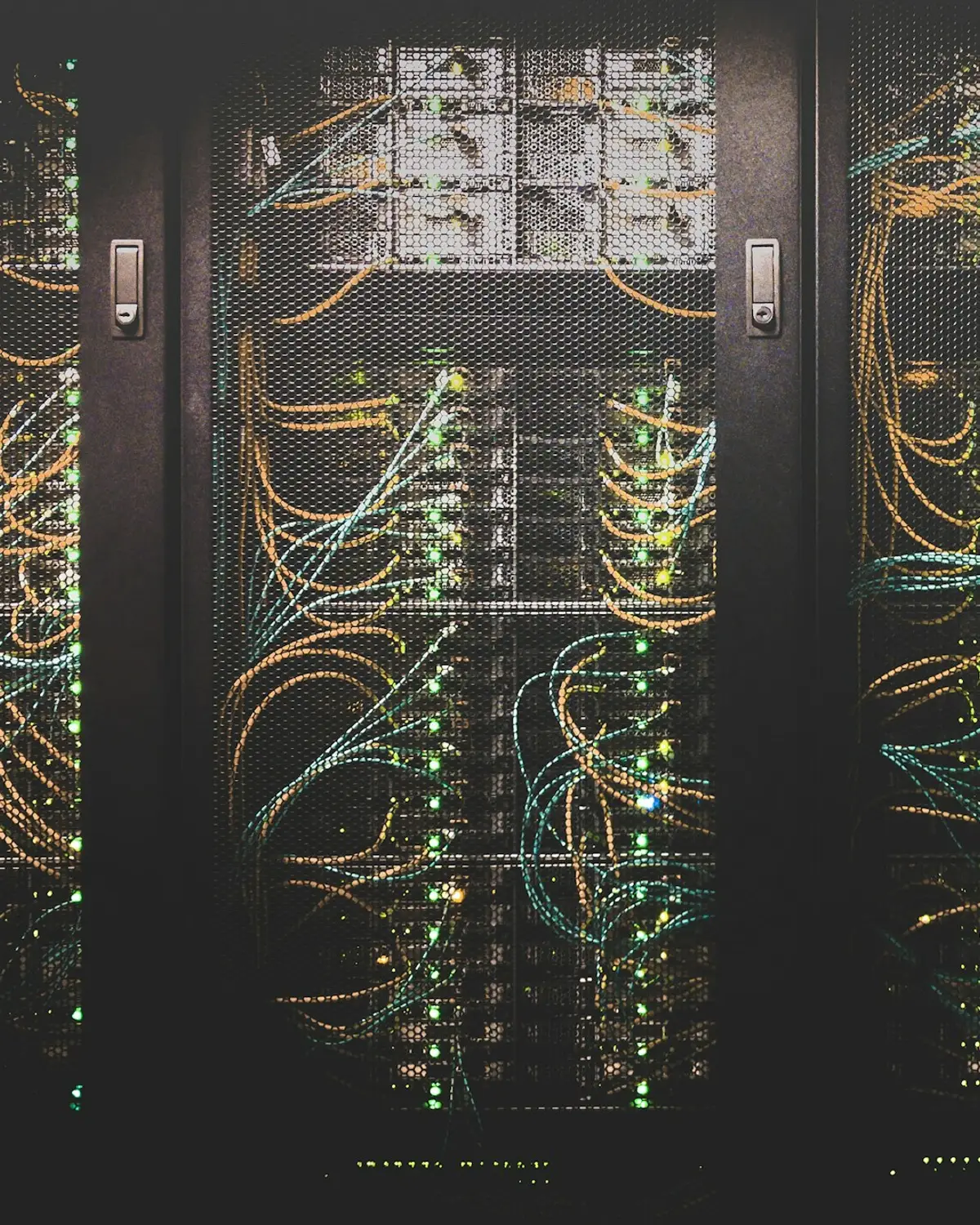 Server racks with network cables and status lights